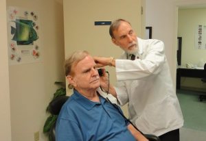 doctor is examining a patient in the office