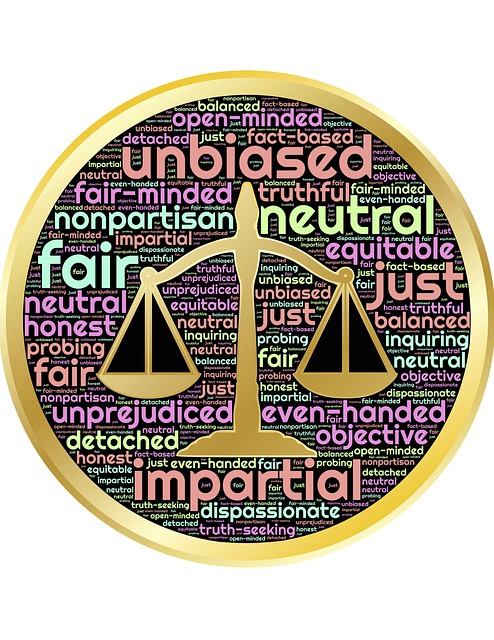 Justice scale with words of justice filling the background